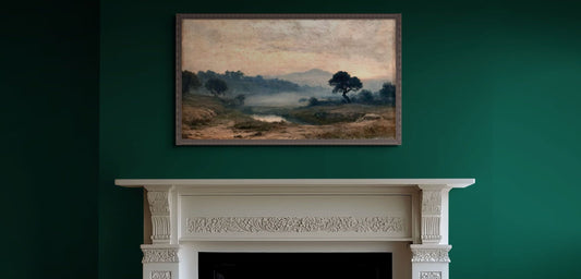 Living room with a fireplace, green wall, and framed landscape painting.