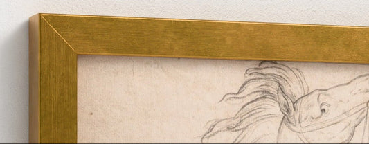 Framed drawing of a horse and rider on textured paper with gold frame.
